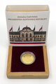 Gold medal stored in a wooden case with an outer sleeve.
