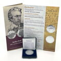 Coin in case with certificate, leaflet and commemorative certificate.