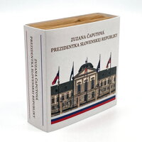 Side view of a wooden case in a paper sleeve. Side view of a wooden case in a paper sleeve.